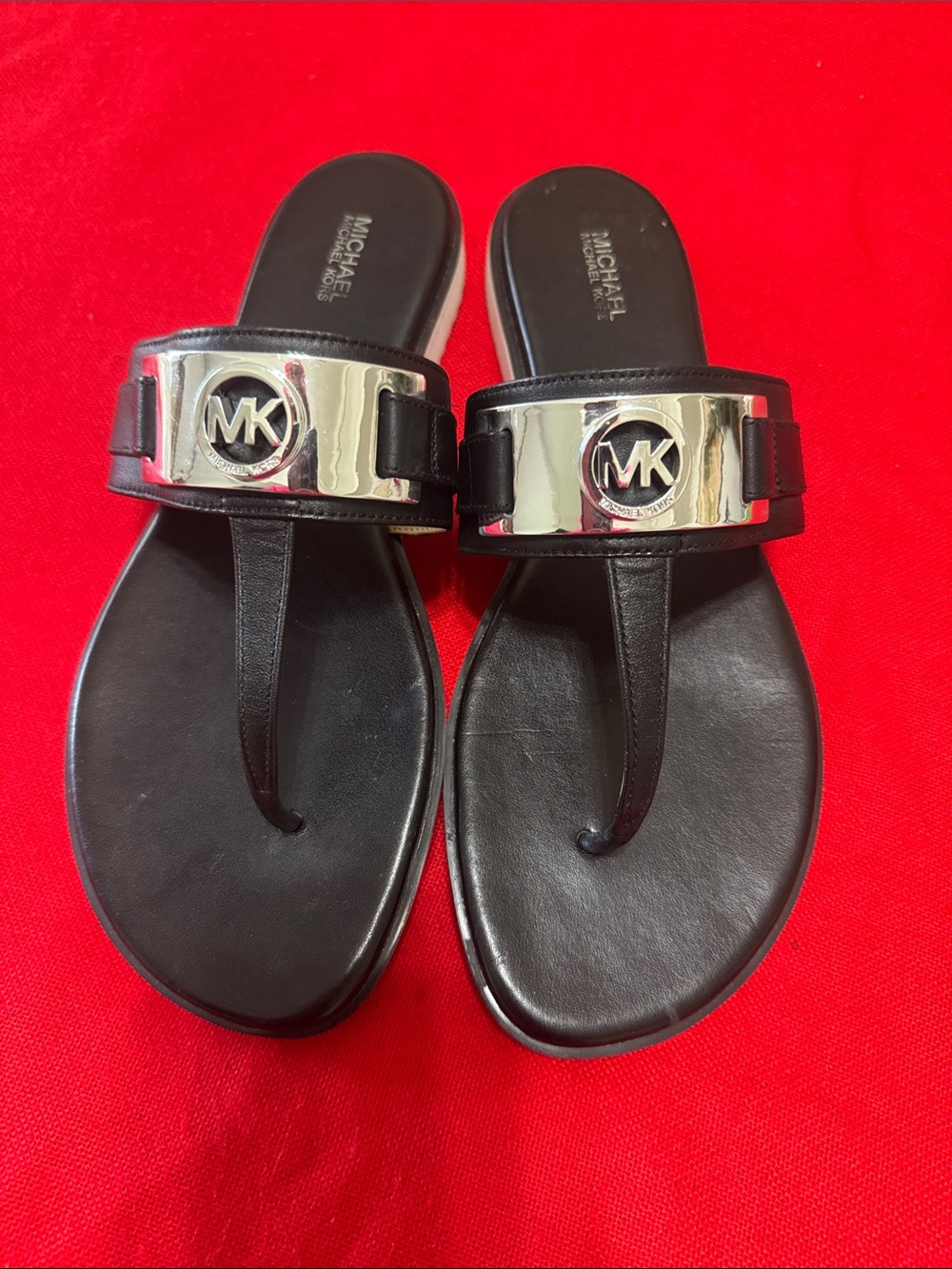 Michael Kors Black Leather Thong Sandals with Silver MK Plaque